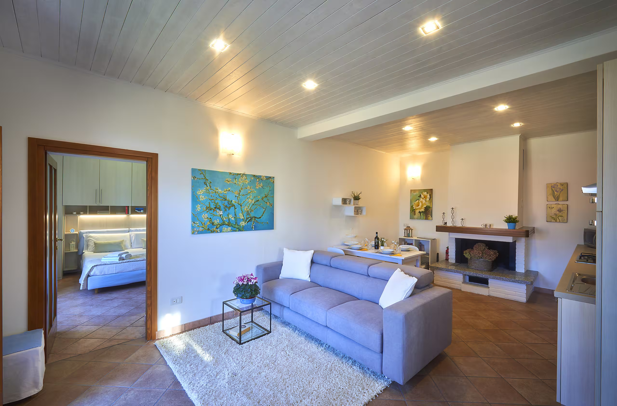 Living room with sofa bed and dining area at Sweet Escape