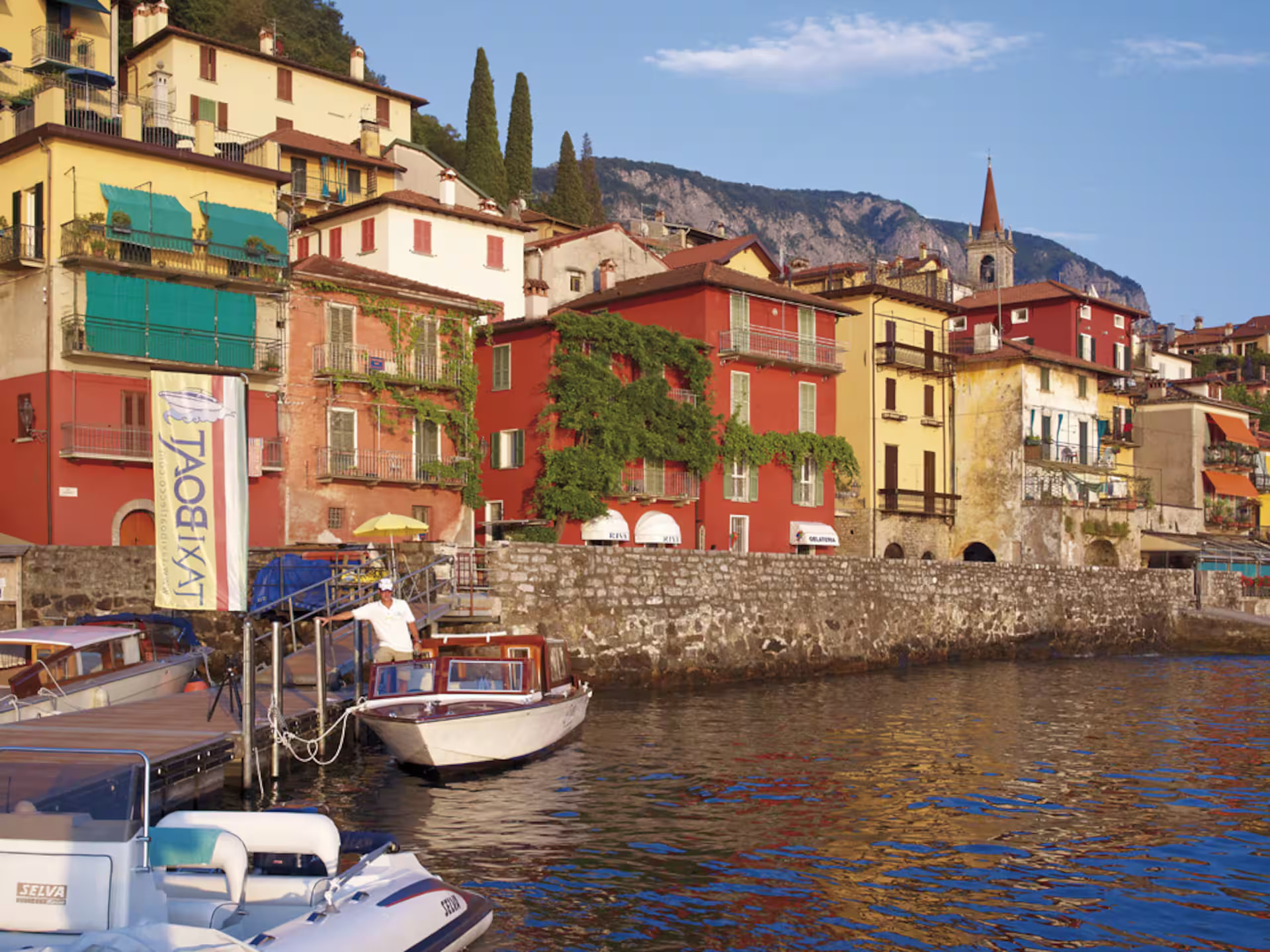 Colourful waterfront houses and boats in Varenna